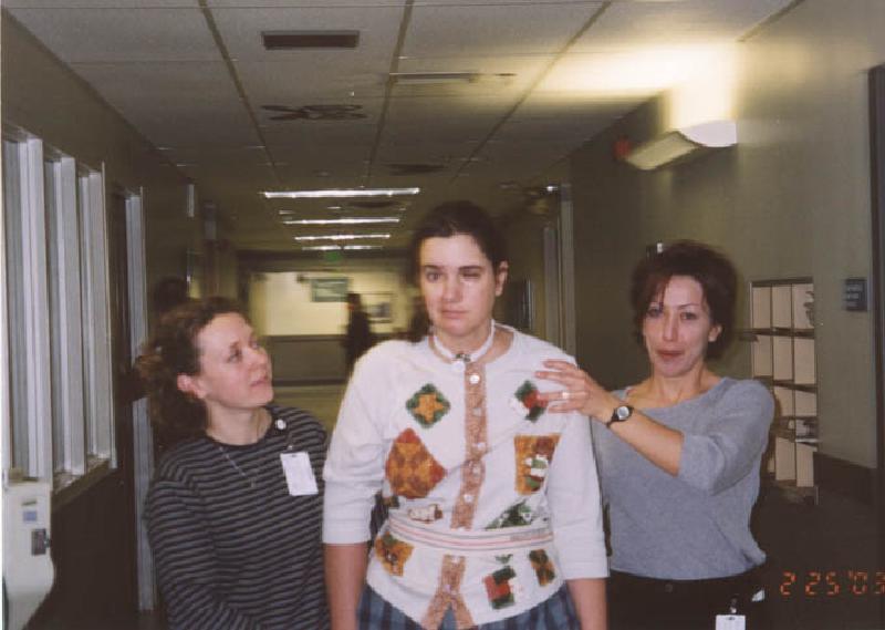 Marla walking on the Unit with Peggy (left) her occupational therapist, and Anne (right), one of her physical therapists.