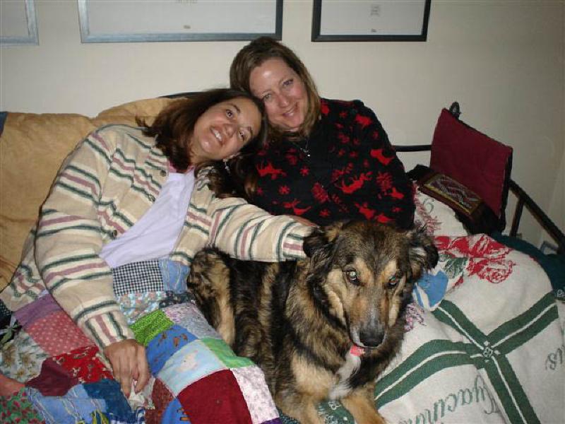 Bandit is ready for the show as Marla and Leigh bundle under blankets on a cold Spring evening in Denver.