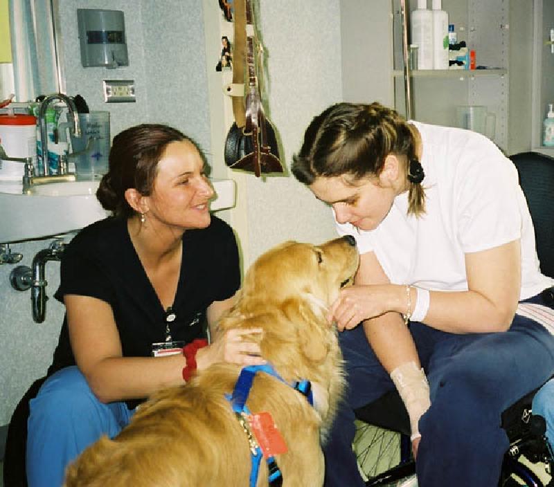 Marla gets a sweet "kiss" from Woody. Rachel, her re-habilitation technician gives him a friendly pat on the back. Rachel's family is from Ouray, Colorado, where Marla's parents grew up.