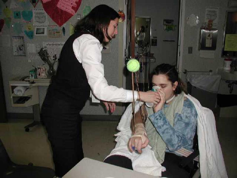Heather Wilson, Marla's speech therapist, works with her to re-develop her swallowing reflex.