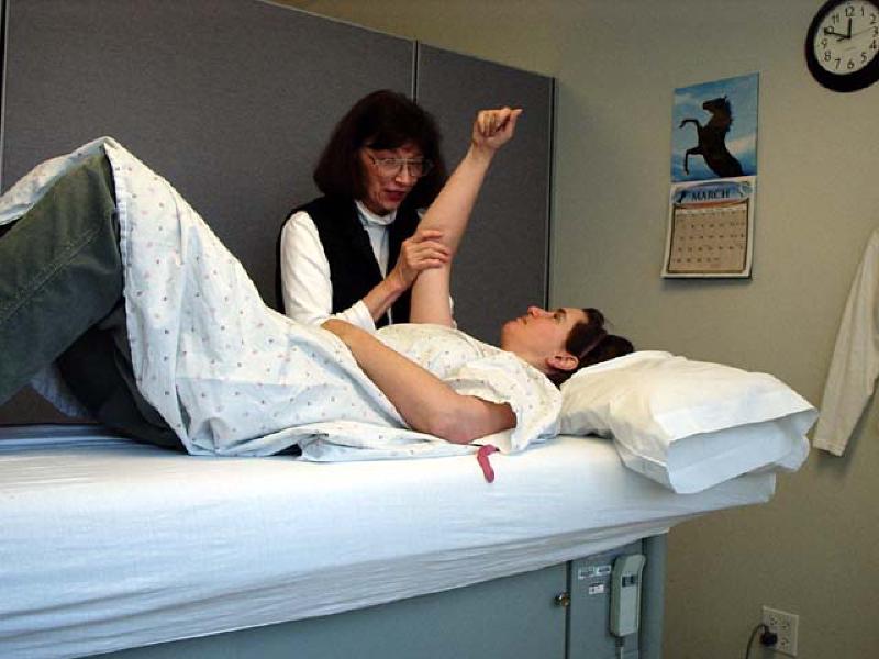 Celeste works with Marla on her right arm during her PT session. Marla has made great strides improving the flexibility in her shoulder!