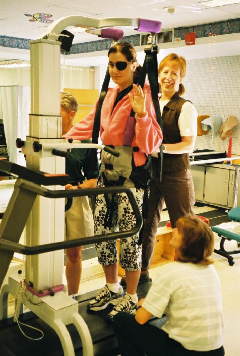 Marla works with Jean on the treadmill, improving her walking coordination and strength.