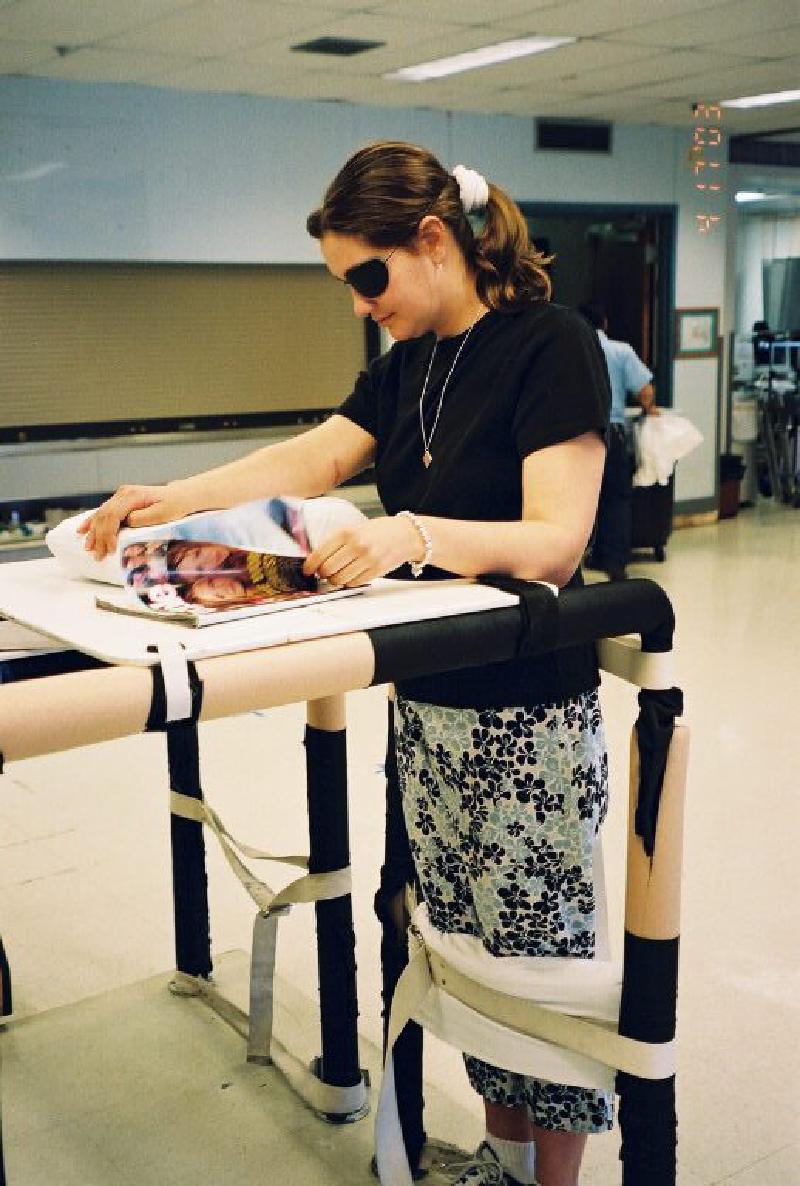 Marla enjoys browsing a magazine while spending some time in the standing table.
