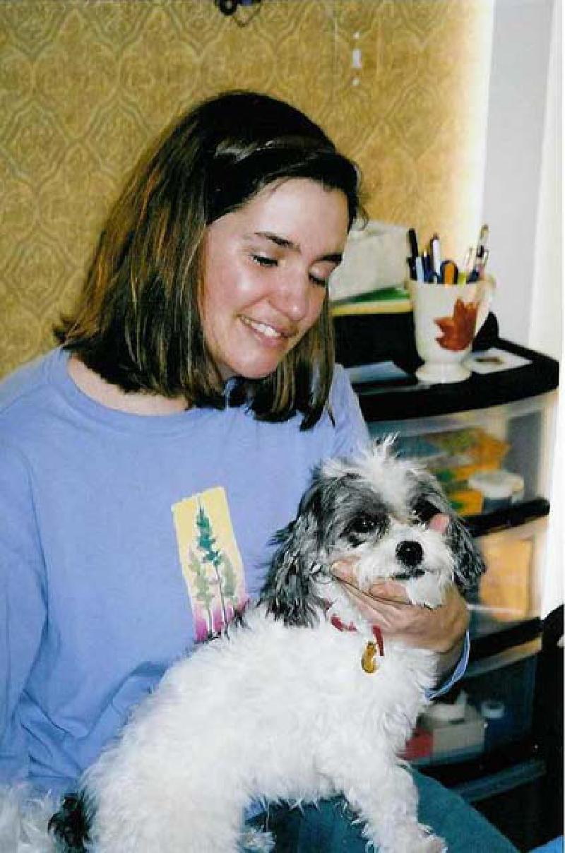 Marla is resplendent with the joy of sharing her lap with a lap-sized Rosie. Puck's probably kinda jealous!