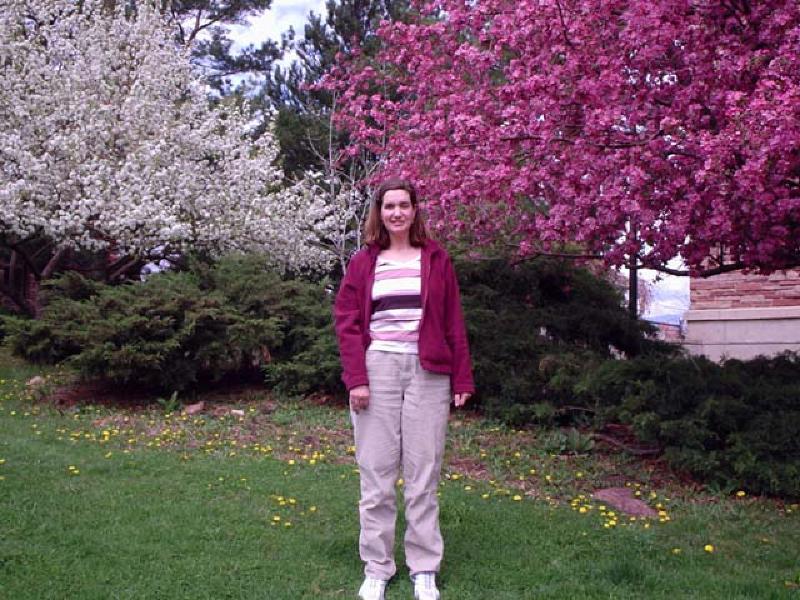 Marla pauses to admire the beautiful blooming trees on the University of Colorado campus in Boulder. She spent two days being evaluated at CU's speech science department for participation in their summer research program. The evaluators (instructors and graduate students) commented on Marla's intelligence, warmth, determination, and were amazed at how well she has already applied a variety of adaptive communication strategies on her own!