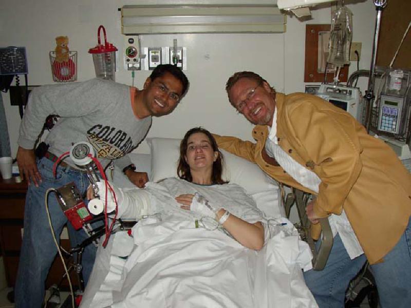 Dr. Sachar, left, is Marla's orthopedic surgeon. He performed the 5 1/2 hour surgery to repair and replace Marla's elbow. Dr. Weintraub, right, is Marla's neurologist at Craig Hospital. He dropped in at Swedish to see how she's doing.