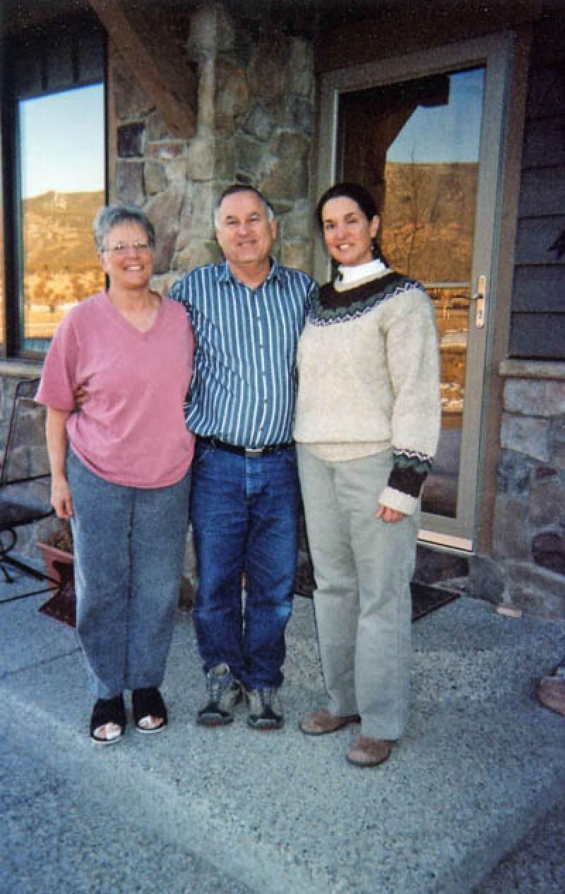 Mary, Leo, and Marla enjoy the view of the mountains from the front door of their new home in New Castle. Mary has bandaged feet from her fall 2005 foot surgery. Poor footsies!