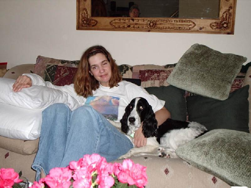 Living it up with "dog time" at every chance she can get, Marla hugs friend Daisy during a visit from friends Julie Andersen and Liz Beerman.