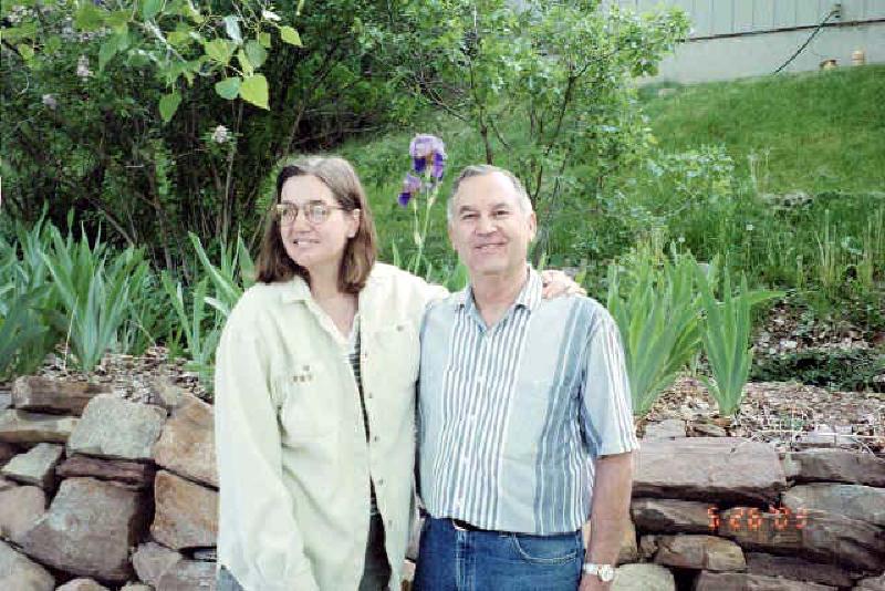 Marla and Leo enjoying the irises in the backyard.