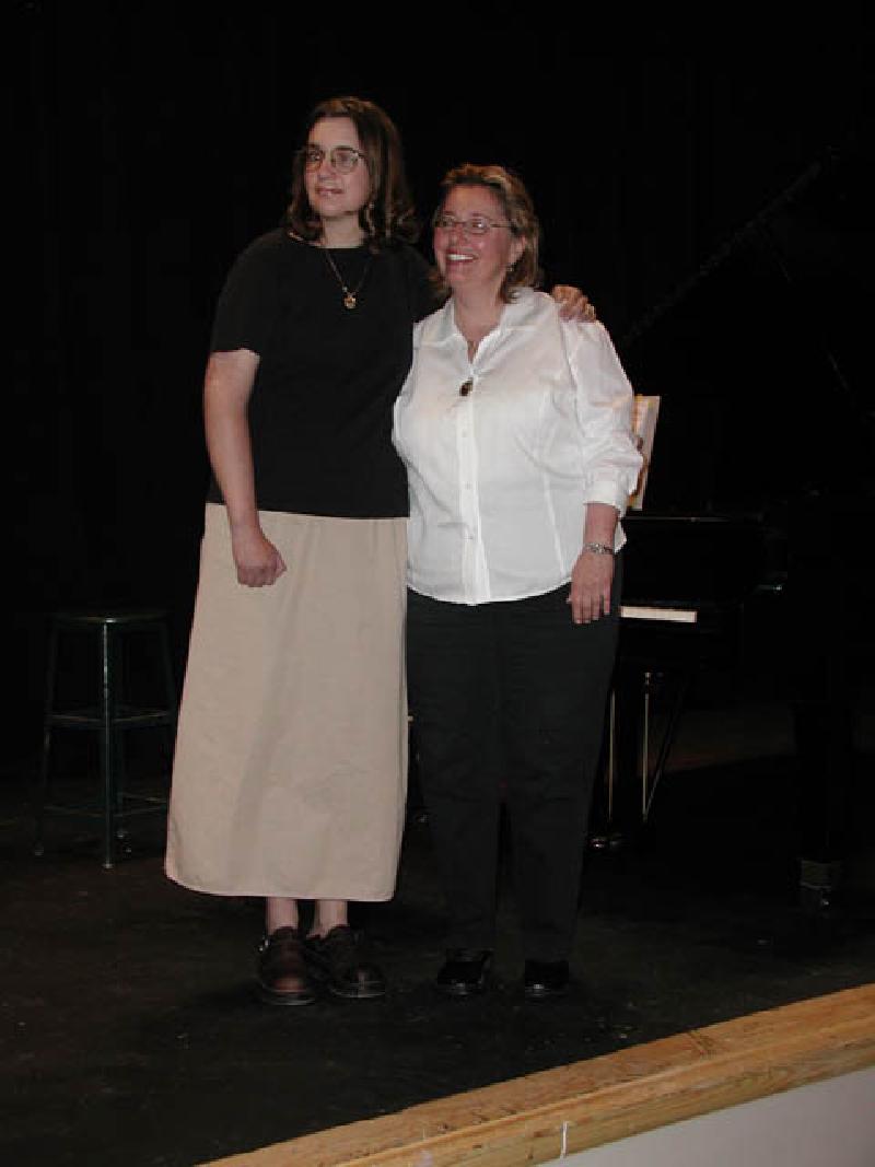 Marla and Roberta share a hug onstage before the concert begins.