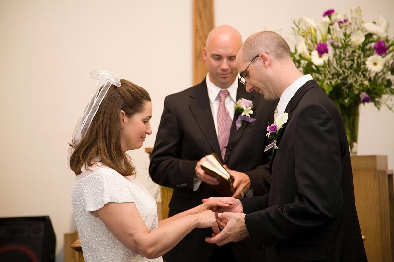 Marla and Mark's Wedding / With this ring... 5/2008 Mark gently places the wedding ring on Marla's finger.