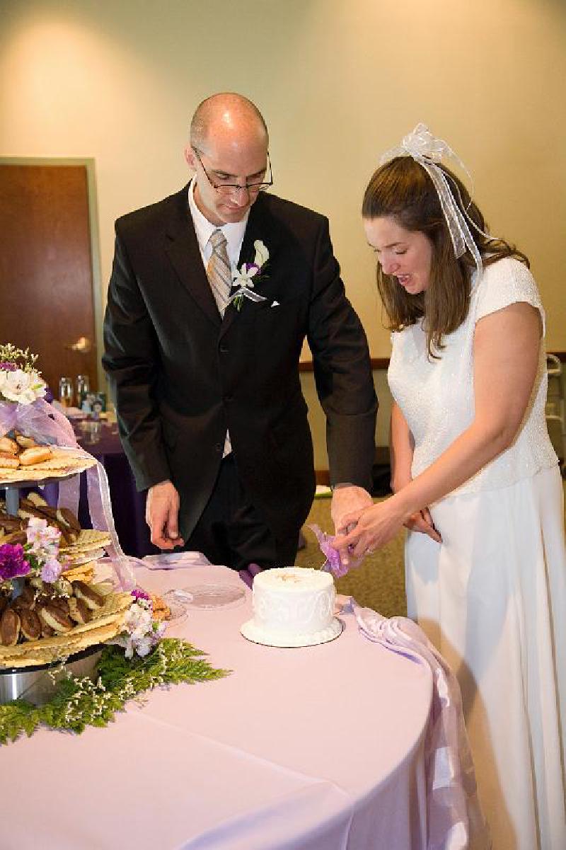 Marla and Mark's Wedding / A Cut Above 5/2008 Mark and Marla cutting the top tier of the cake!