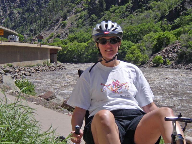 Marla's having a blast bicycling the Glenwood Canyon trail with the spring snowmelt of the Colorado River cascading down the rapids alongside the trail.