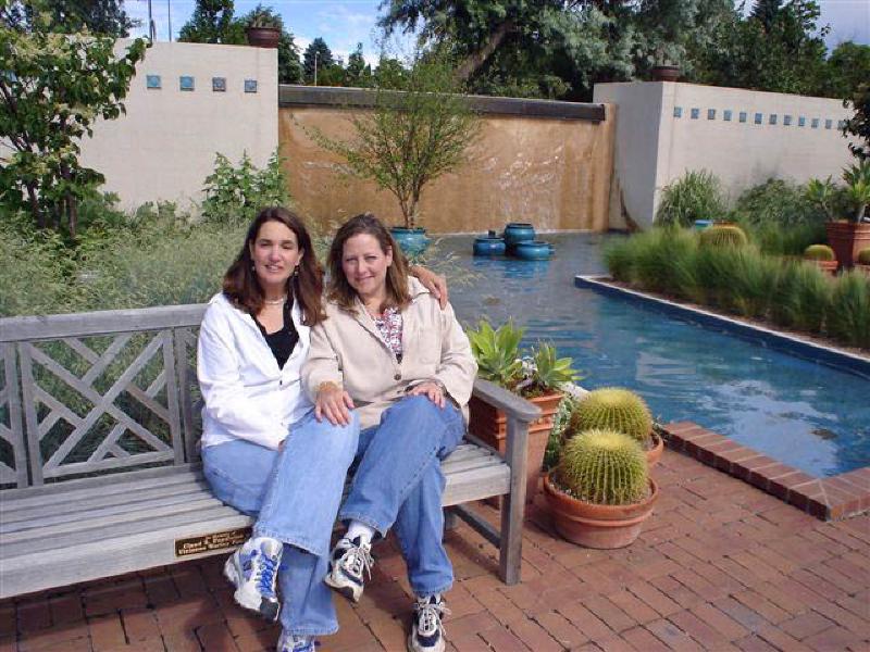 Having fun during their weekend together, Marla and Leigh relax by a pool at the Denver Botanic Gardens.