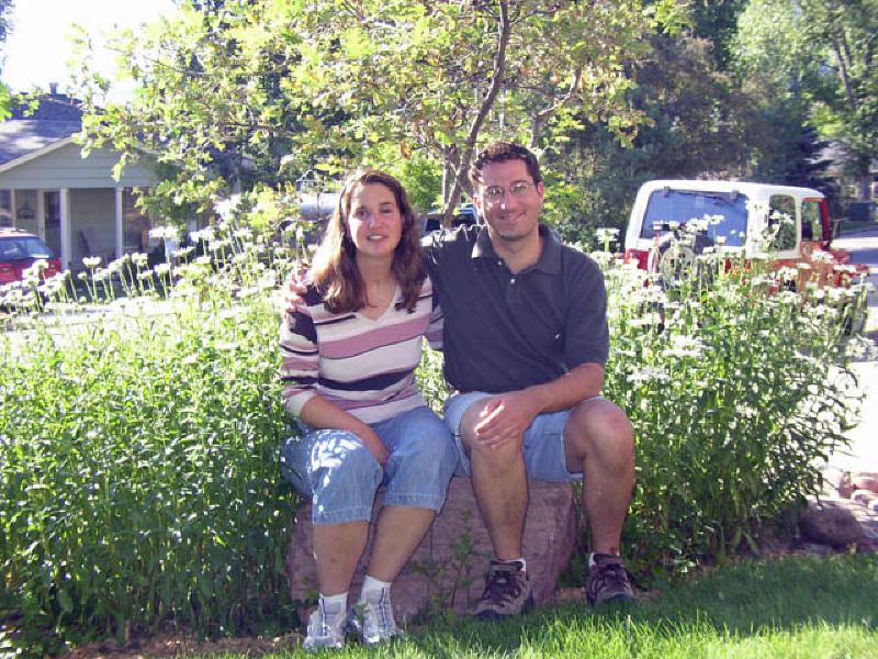 Marla and Mark pose on a rock in front of the house in Glenwood Springs, shortly before the big move.