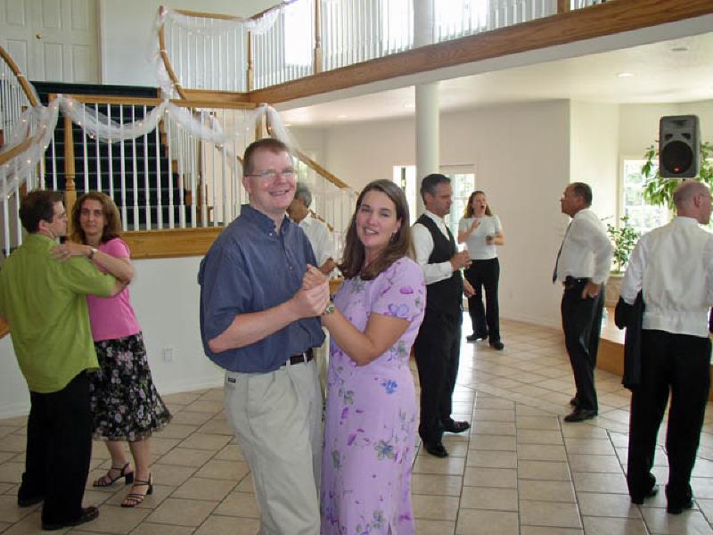 Mark and Marla's friend from college, Joslyn Schoemer, got married in July. Marla's having fun dancing with college friend Scott Sveum.