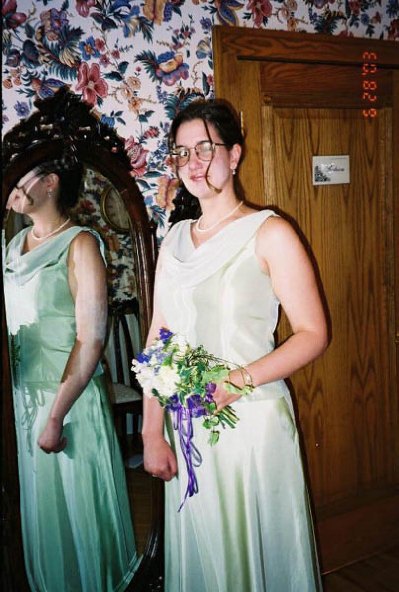 Marla models her Bridesmaid's attire and bouquet. She looks fabulous!