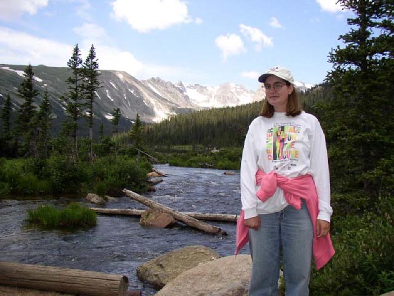 Marla stops to enjoy the scenery near the stream flowing from Long Lake, in the Indian Peaks Wilderness area west of Boulder.