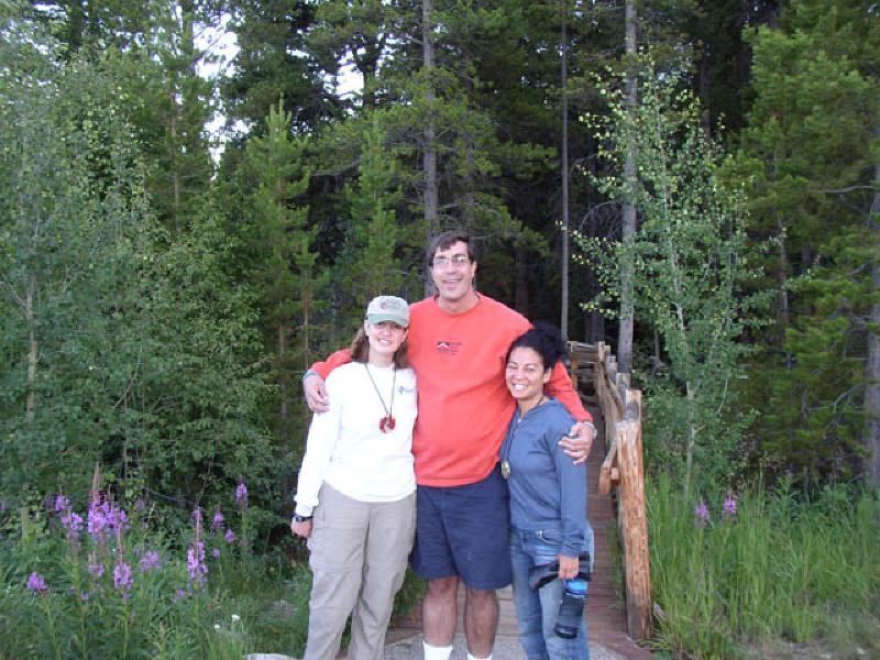 Marla, Ed, and Vikki are taking in the scenery and wildflowers on a walk around the lake afterdinner. Ed Reinhardt, a fellow camper, was a CU Football player 20 years ago, whenhe suffered a traumatic brain injury on the field of play. Ed and his father team up togive motivational speeches.