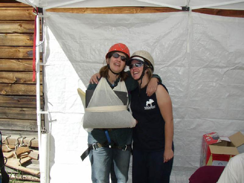 Marla and Sally share a hug and show off their handiwork in creating the padded sling.