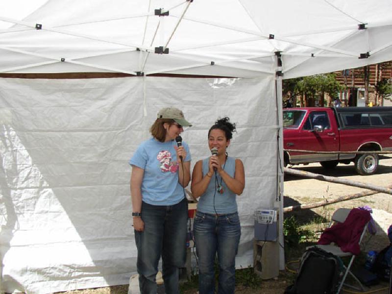 Giggling after their success on the climbing wall, Marla and Vikki entertain the otherclimbers with their tunes on the Karaoke.