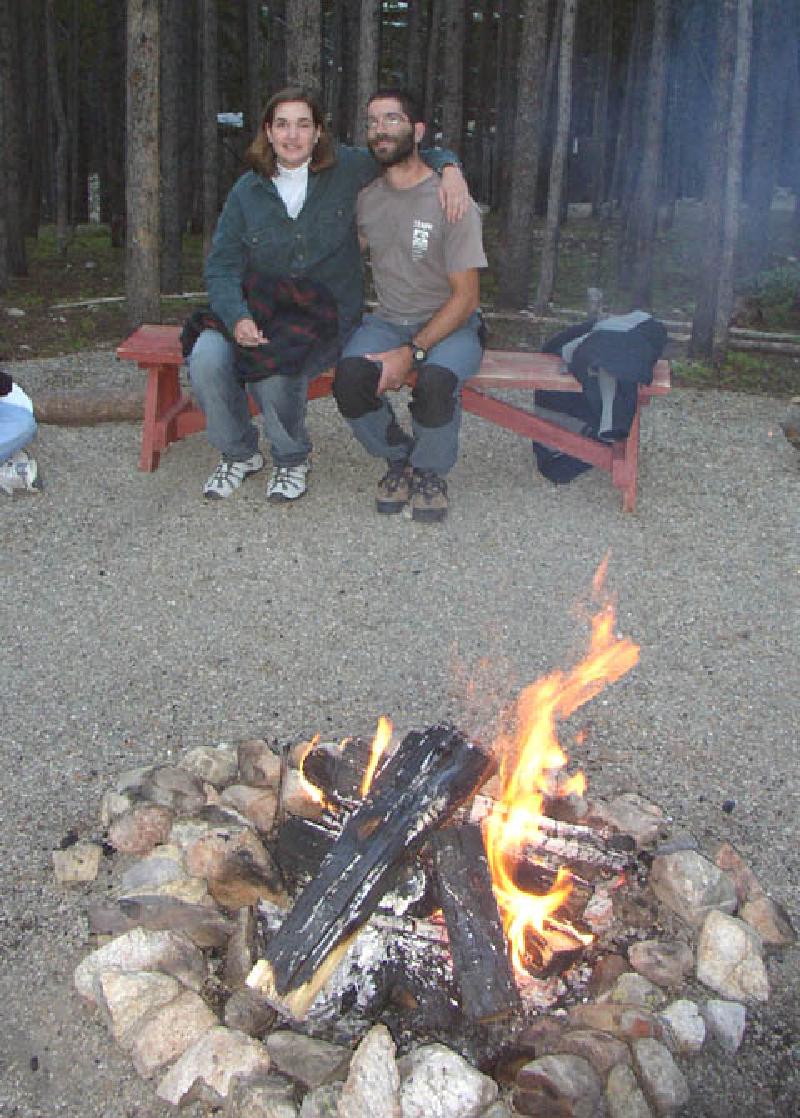 Marla and BOEC instructor Eric Marchese soaking up the warmth of the campfire.