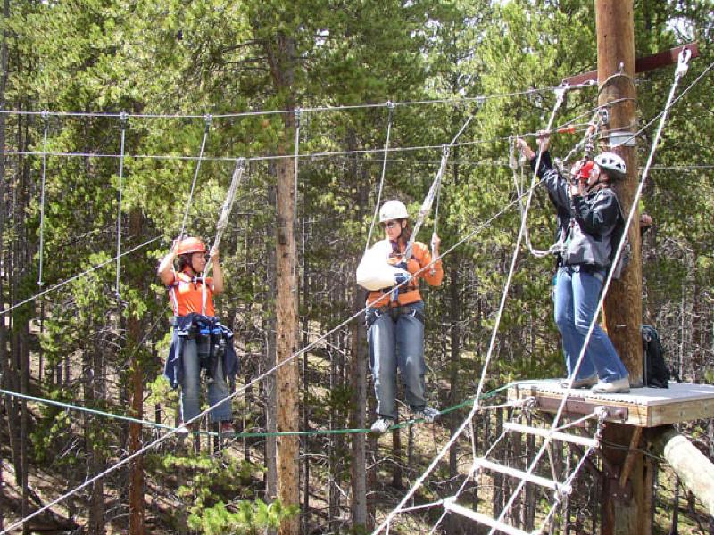Vikki leads the way as Marla works her way through the hanging vines. One-handed,Marla had to improvise a technique to transition from rope to rope. She would reachacross with her head to nudge the next rope into her left hand. Quite clever!
