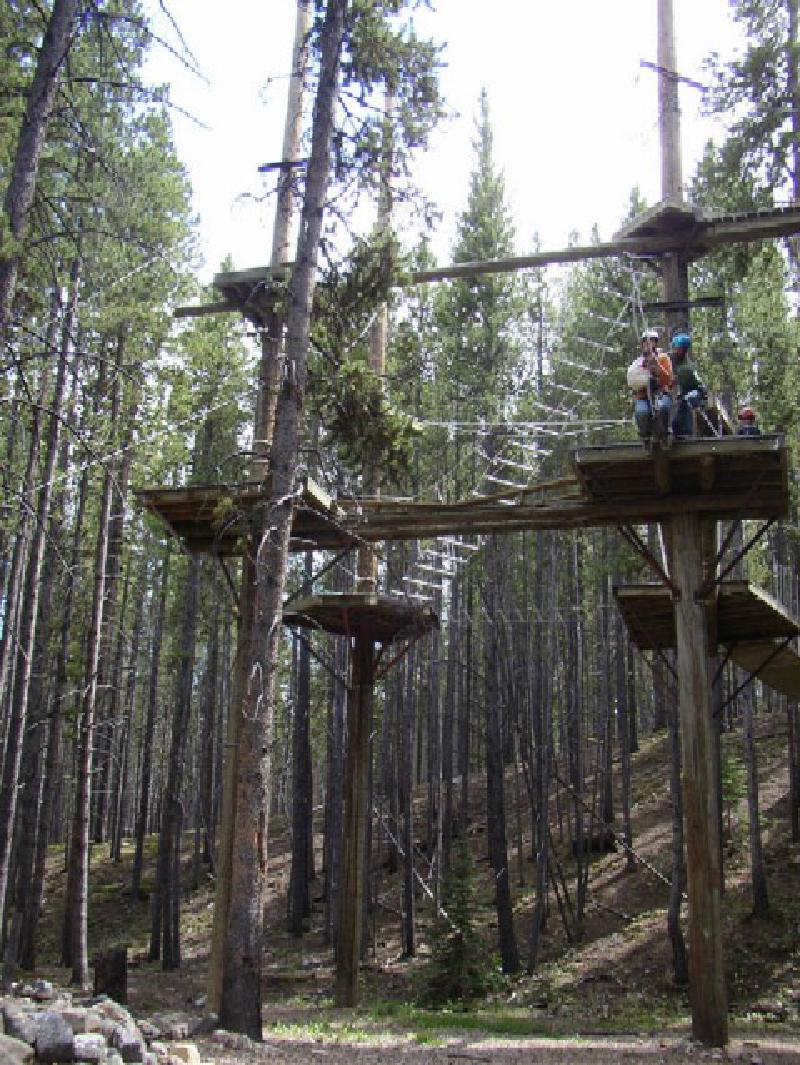 Marla takes the plunge as she steps off the platform and rides down the zip line!Wheeeee!