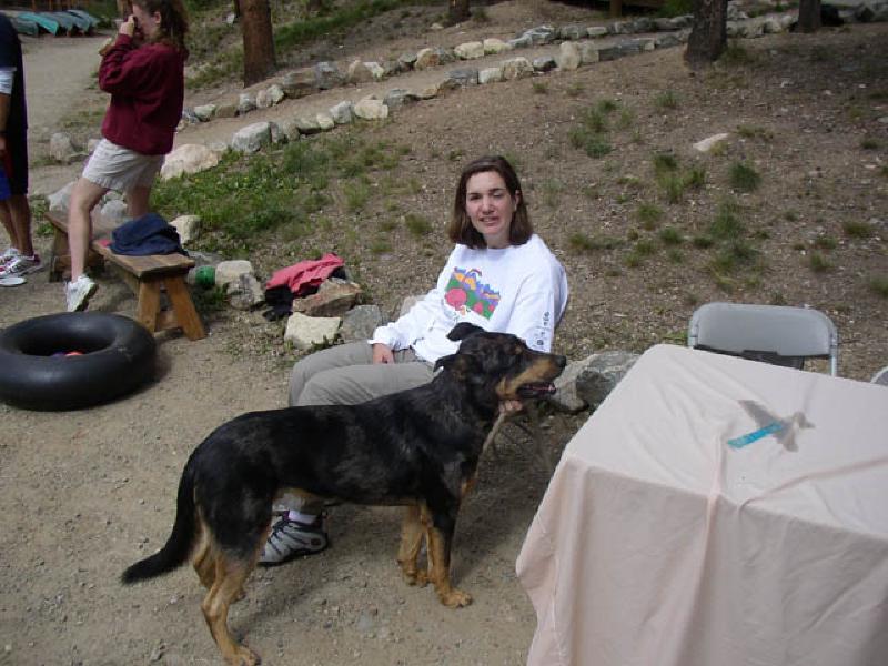 Marla relaxes while petting Leon the dog, a companion of one of the BOEC staffers.