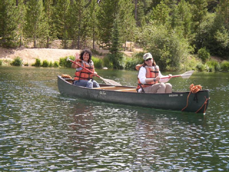 Vikki and Marla slicing their way across the lake in a canoe. Notice how Marla is usingher right hand and arm on the oar!