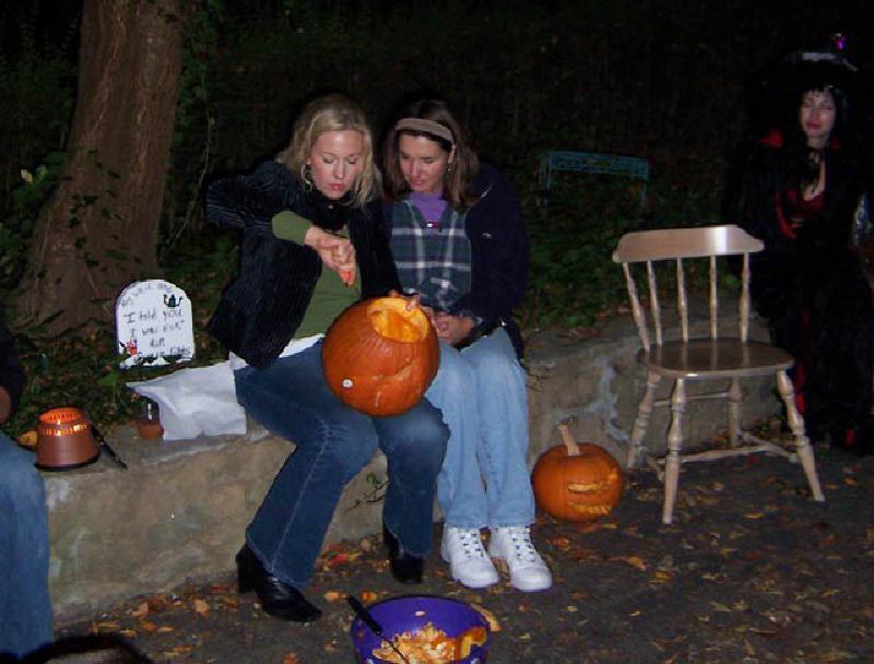 Nicole and Marla carving their Halloween masterpieces at a pumpkin carving party hosted by a friend of Nicole.