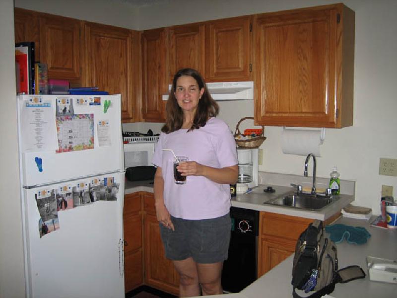 Marla prepares a drink in the kitchenette of the apartment suite in which she lived during her time in Ann Arbor.