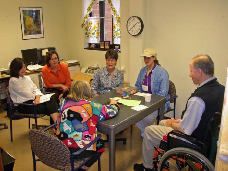 During group therapy, Marla and her fellow patients have the chance to work on their speech in a fun atmosphere, working on using full sentences and correct grammar while playing a board game.