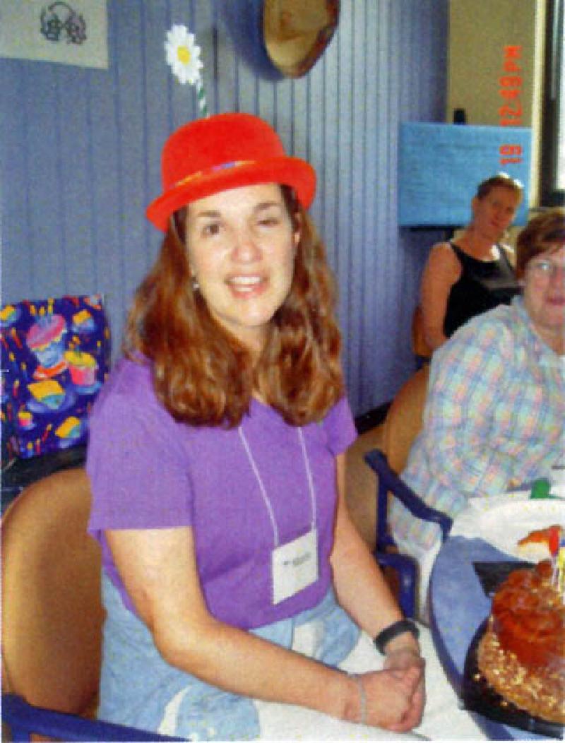 Marla grins in her goofy clown hat before blowing out her candles! Make a wish!