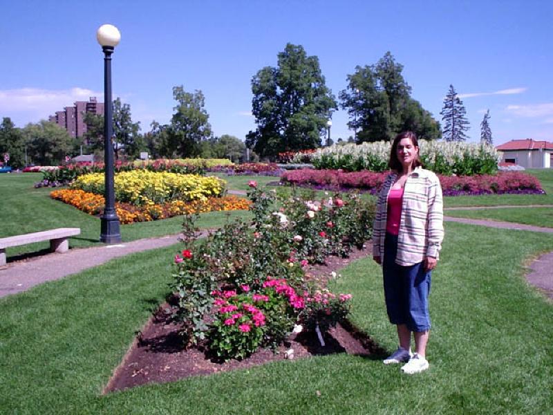 Marla admires the beautiful flowers during a walk through Washington Park in Denver on a beautiful fall day.