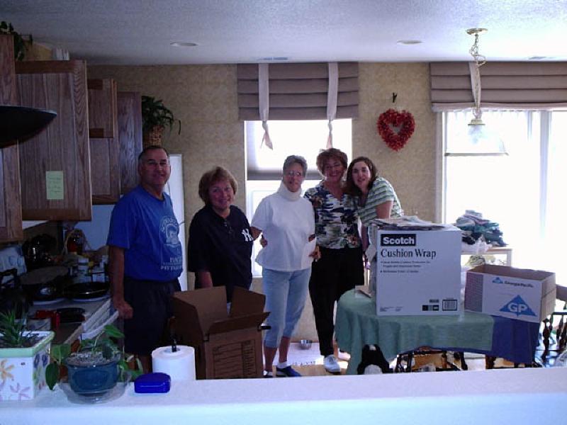 Friends Julie Anderson and Liz Beerman helping out with the packing of Marla's kitchen.
