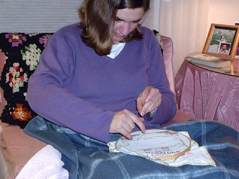 Marla is working on a cross-stitch as a gift for a friend. It is also great exercise--notice how she's using that right hand and arm!