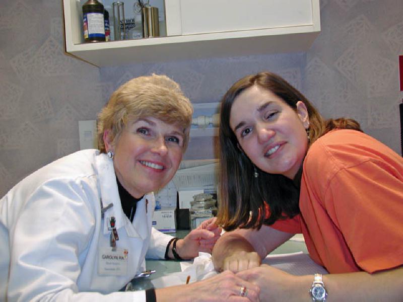 Dr. Sachar's nurse, Caroline, removes the staples from the incision.