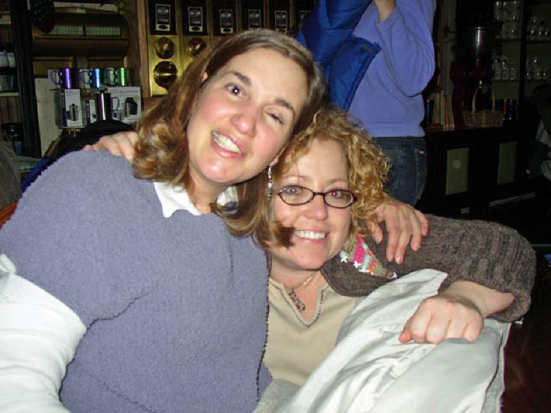 Marla and Sarah share a hug while listening to the sounds of SoulFeel.