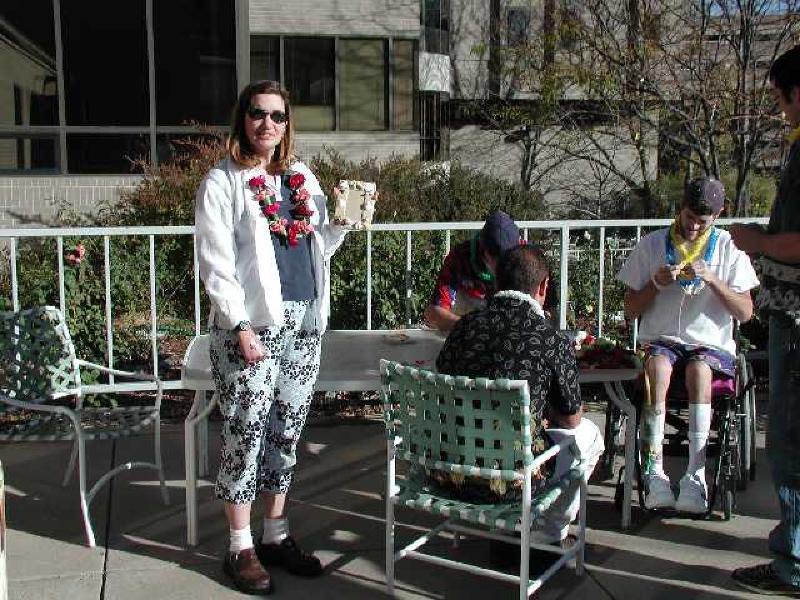 Marla enjoys the sunshine at the Craig hospital Cafeteria patio while sporting her L'ei.