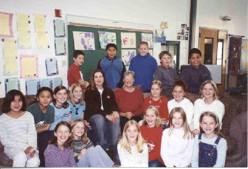 Marla and Mary surrounded by the students of Marty Mazzota's 5th Grade class at Sopris Elementary School in Glenwood Springs. The class practiced doing everyday tasks like putting on coats, hats and gloves, and tying shoes with non-dominant hands, similar to what Marla has had to learn. They created flash cards with pictures of common items to help Marla regain her vocabulary, and invited her to join their class for a visit. The students wrote letters to Marla and read them to her during her visit. It was a great learning experience for everyone involved, and the class continues to communicate with Marla and encourage her recovery."