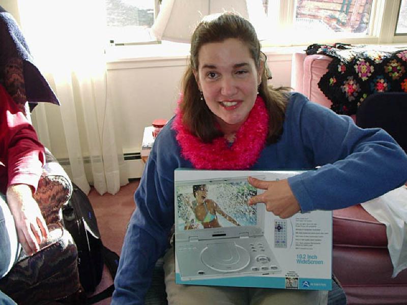 Marla is excited at what Santa brought for the family--a portable DVD player.