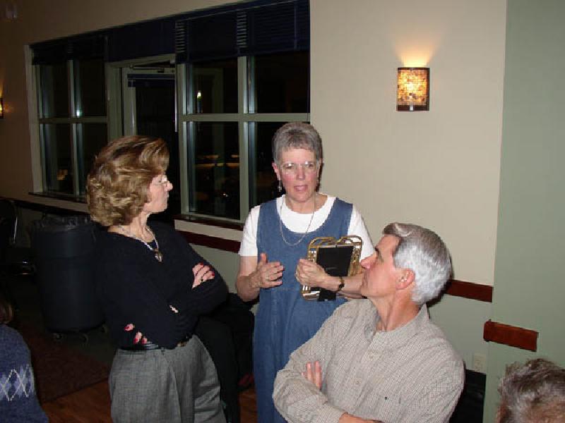 Nancy and Jim Barnett, friends from the Sopris Barracudas swim team, talking with Mary Williams, Marla's Mom (center).