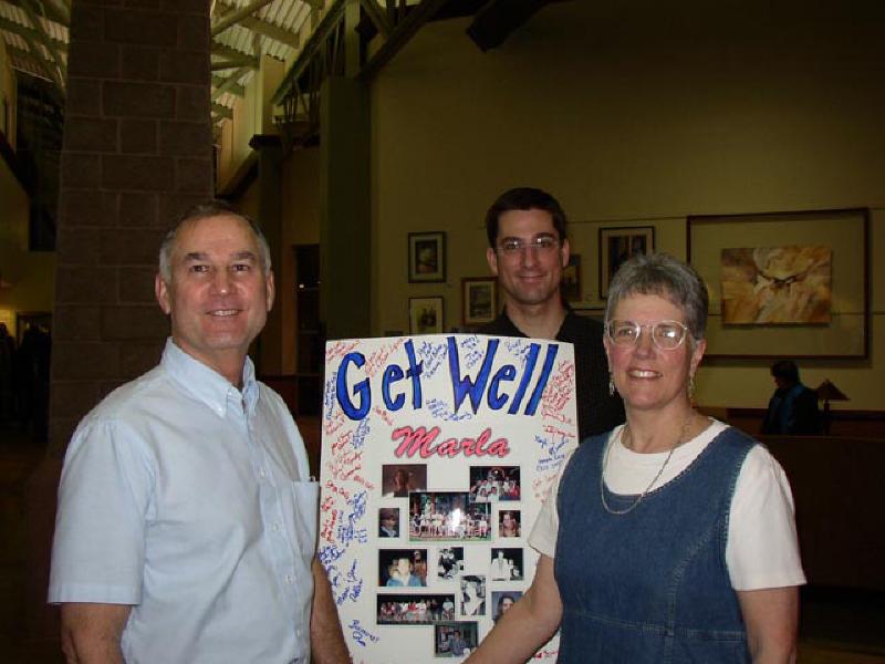 Marla's father Leo, brother Mark, and mother Mary Williams, smiling with all the positive energy of the evening.