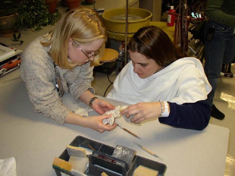 Heather, one of Marla's favorite rehabilitation technicians, and Marla enjoy working on ceramics in the therapeutic recreation department after dinner. All in all, a busy day!